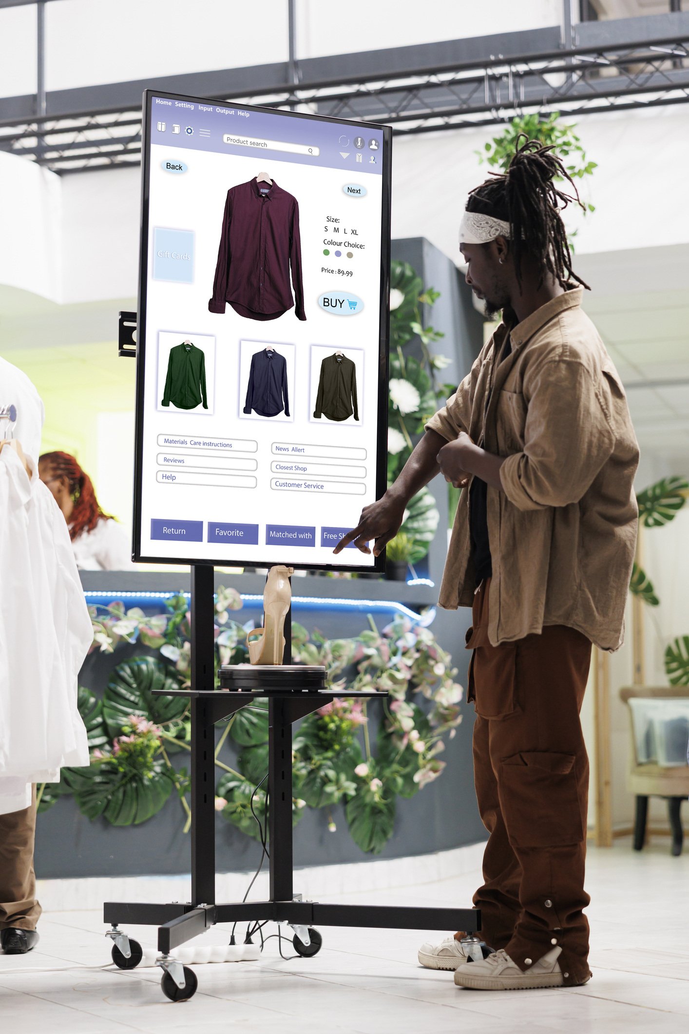 Man interacting with in store kiosk